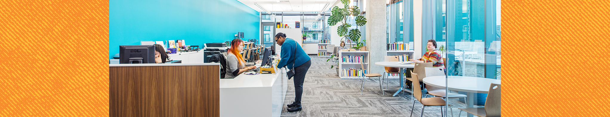 Four people in the library of antioch university seattle